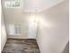 Open foyer with a view to the front door and wood-look flooring at 4857 Tarcoola Ln, Highlands Ranch, CO 80130