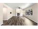 Spacious living room with neutral paint, fireplace, ceiling fan, and large window providing ample natural light at 4857 Tarcoola Ln, Highlands Ranch, CO 80130