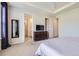 Bright bedroom features a dresser, ensuite bathroom, walk-in closet, and soft natural light at 515 176Th Ave, Broomfield, CO 80023