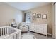 Adorable Bedroom with white furniture, natural light, and playful decor, creating a cozy and inviting space at 515 176Th Ave, Broomfield, CO 80023