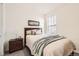 Comfortable bedroom with a well-made bed, soft lighting, and a dresser at 515 176Th Ave, Broomfield, CO 80023