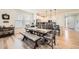 Dining area featuring a large wooden table, bench seating, and hardwood floors at 515 176Th Ave, Broomfield, CO 80023