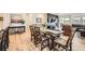 Modern dining area with hardwood floors and view into living room and fireplace at 515 176Th Ave, Broomfield, CO 80023