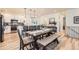 Open-concept dining area featuring a large wooden table and hardwood floors at 515 176Th Ave, Broomfield, CO 80023