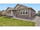 Exterior view of home showing deck, large windows, and gravel landscaping at 515 176Th Ave, Broomfield, CO 80023