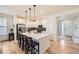 Modern kitchen with quartz countertops, pendant lighting, stainless steel appliances and wood floors at 515 176Th Ave, Broomfield, CO 80023