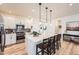 Modern kitchen with quartz countertops, pendant lighting, and stainless steel appliances at 515 176Th Ave, Broomfield, CO 80023