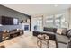Cozy living room with a fireplace, tv, and comfortable seating, with sliding door to backyard at 515 176Th Ave, Broomfield, CO 80023