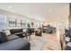 Open concept living room with hardwood floors and view to dining and kitchen at 515 176Th Ave, Broomfield, CO 80023