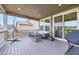 Relax on the covered patio with outdoor seating, a fire pit, and serene views of the neighborhood at 515 176Th Ave, Broomfield, CO 80023