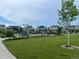 Community playground with slides and climbing structures, surrounded by green spaces at 515 176Th Ave, Broomfield, CO 80023