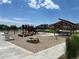 Community playground featuring state-of-the-art equipment, shade structure, and plenty of room for fun at 515 176Th Ave, Broomfield, CO 80023