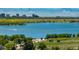Scenic view of the community lake with mountains and city skyline in the background at 16724 E Hialeah Ave, Centennial, CO 80015