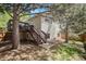 Backyard featuring a wood fence and a two-story deck with stair access at 16724 E Hialeah Ave, Centennial, CO 80015