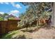 View of a fenced-in backyard with a mature tree providing shade at 16724 E Hialeah Ave, Centennial, CO 80015