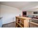 Finished basement bar with shelving, cabinets, and seating in a finished basement at 16724 E Hialeah Ave, Centennial, CO 80015