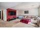Finished basement with large tv and sectional couch at 16724 E Hialeah Ave, Centennial, CO 80015