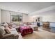 Finished basement with a large sectional couch and full bar at 16724 E Hialeah Ave, Centennial, CO 80015