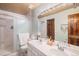 Bathroom features a dual sink vanity and walk-in shower at 16724 E Hialeah Ave, Centennial, CO 80015