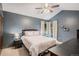 This bedroom is spacious with neutral carpet, ceiling fan, and a vaulted ceiling at 16724 E Hialeah Ave, Centennial, CO 80015