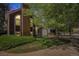 Beautiful exterior view of a house featuring a brick accent wall and mature trees at 16724 E Hialeah Ave, Centennial, CO 80015