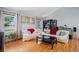 Bright living room featuring hardwood floors and a large window at 16724 E Hialeah Ave, Centennial, CO 80015