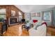This open living room offers a fireplace, hardwood floors and lots of natural light at 16724 E Hialeah Ave, Centennial, CO 80015