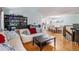 Open living room leads to dining area and staircase at 16724 E Hialeah Ave, Centennial, CO 80015