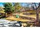 The backyard features a small treehouse, a grass lawn, a sidewalk and plants at 6368 S Emporia Cir, Englewood, CO 80111