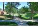 Backyard walking trail featuring lush green spaces, trees and a bridge at 6368 S Emporia Cir, Englewood, CO 80111
