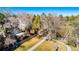 Aerial view of the backyard featuring trees, a walkway, grass and a house in the background at 6368 S Emporia Cir, Englewood, CO 80111