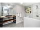 Contemporary bathroom featuring stylish fixtures, modern tiling, and a glass-enclosed shower at 6368 S Emporia Cir, Englewood, CO 80111