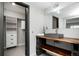 Unique bathroom with a custom vanity, industrial design elements, and a well-lit space at 6368 S Emporia Cir, Englewood, CO 80111
