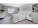 Serene bedroom with a large window, plush bedding, and stylish bedside tables at 6368 S Emporia Cir, Englewood, CO 80111
