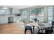 Bright kitchen area with stainless steel appliances and casual dining area at 6368 S Emporia Cir, Englewood, CO 80111