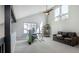 Bright living room with vaulted ceilings, comfortable seating, and ample natural light at 6368 S Emporia Cir, Englewood, CO 80111