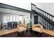 Cozy living room featuring modern design elements and hardwood floors at 6368 S Emporia Cir, Englewood, CO 80111