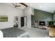 Spacious vaulted ceiling bedroom with fireplace, seating area, ensuite bath, and neutral carpet at 6368 S Emporia Cir, Englewood, CO 80111