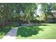 Community playground featuring green grass, a slide and a swing set at 6368 S Emporia Cir, Englewood, CO 80111