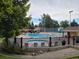 Community pool featuring chairs, water, and a fence in a green space at 6368 S Emporia Cir, Englewood, CO 80111