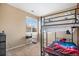 Bedroom featuring a black bunkbed and window for natural light at 12943 N Lafayette St # H, Thornton, CO 80241