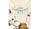 Tastefully remodeled bathroom features a shower-tub, white vanity and a framed mirror at 8820 Cody St, Broomfield, CO 80021
