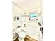 Well-lit bathroom with stylish fixtures, tiled shower-tub combo, and modern decor accents at 8820 Cody St, Broomfield, CO 80021