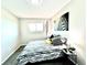 Stylish bedroom featuring zebra art, striped bedding, and a modern side table with sleek lamp at 8820 Cody St, Broomfield, CO 80021