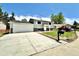 Charming two-story home with a spacious driveway, attached two-car garage, and beautifully maintained lawn at 8820 Cody St, Broomfield, CO 80021