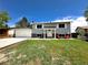 Well-maintained two-story home with a green lawn and concrete driveway, showcasing classic suburban charm at 8820 Cody St, Broomfield, CO 80021