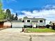 Inviting two-story home with lush lawn, driveway, and garage, offering a blend of comfort and curb appeal at 8820 Cody St, Broomfield, CO 80021