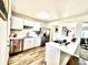 Modern kitchen featuring stainless steel appliances, crisp white cabinets and eat-in counter at 8820 Cody St, Broomfield, CO 80021