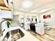 Bright kitchen offering modern countertops, stainless steel appliances, and seamlessly connects to the living space at 8820 Cody St, Broomfield, CO 80021