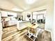 Open-concept kitchen featuring modern appliances, white cabinetry, and a seamless transition to the living area at 8820 Cody St, Broomfield, CO 80021